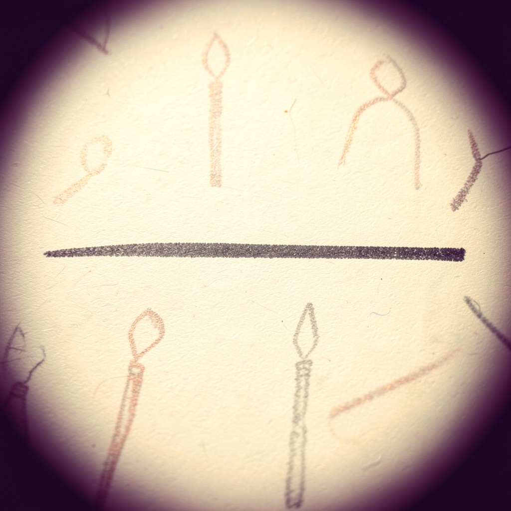 Macro photograph of a single horizontal pencil line crossing faint candlestick shapes on cream paper